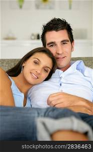 Couple relaxing on couch