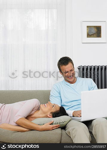 Couple Relaxing on Sofa