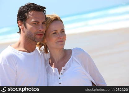 Couple relaxing on the beach