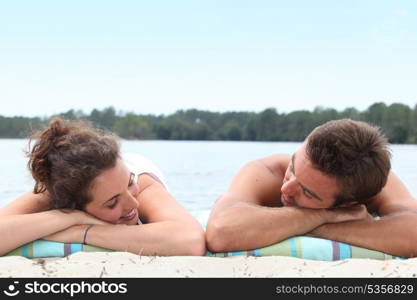 Couple relaxing on the beach