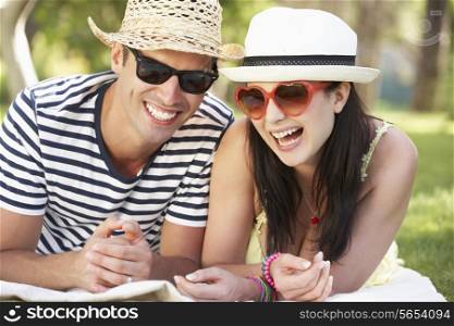 Couple Relaxing Together In Garden