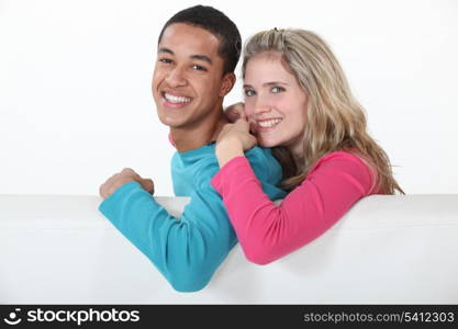 Couple relaxing together on sofa