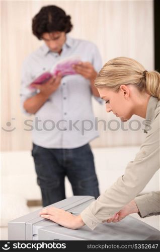 Couple repairing television