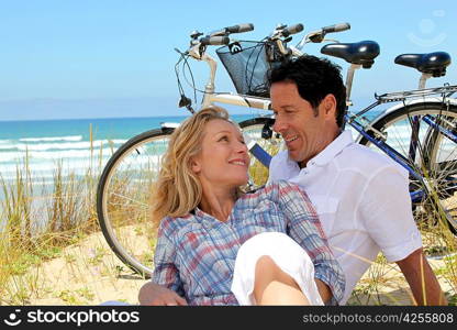 Couple resting by the sea