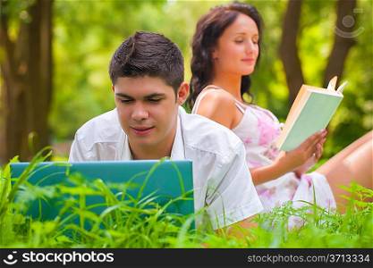 couple resting on nature