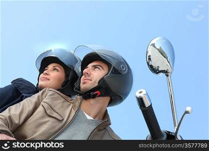 Couple riding a motorcycle