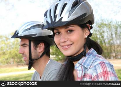 Couple riding mountain bikes