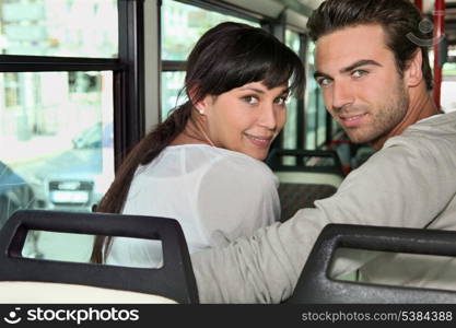 Couple riding the bus together