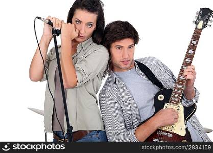 Couple rocking in a band