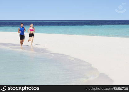 Couple Running On Beautiful Beach