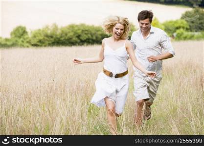 Couple running outdoors smiling