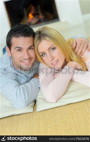 Couple sat by the fire place