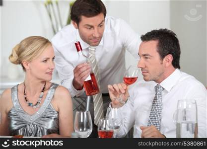 Couple sat drinking wine