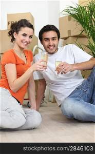 Couple sat in new apartment