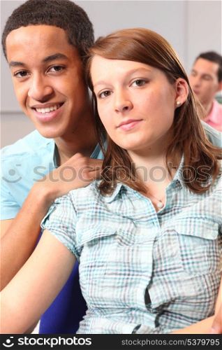 Couple sat in university lecture