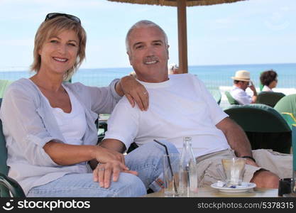 Couple sat on hotel terrace