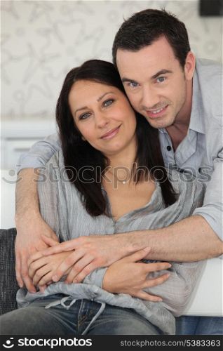 Couple sat on sofa together