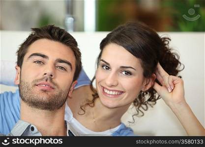 Couple sat watching television