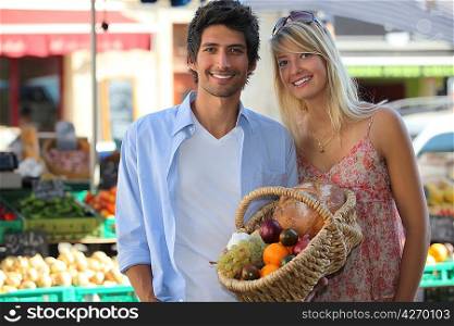 Couple shopping at market