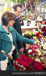 Couple shopping for flowers in a florist shop