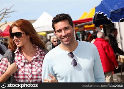 Couple shopping in outdoor market