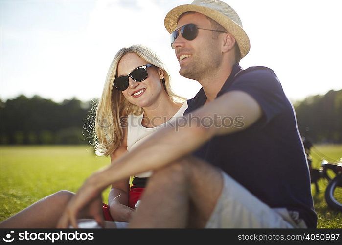 Couple sitting and chatting in park