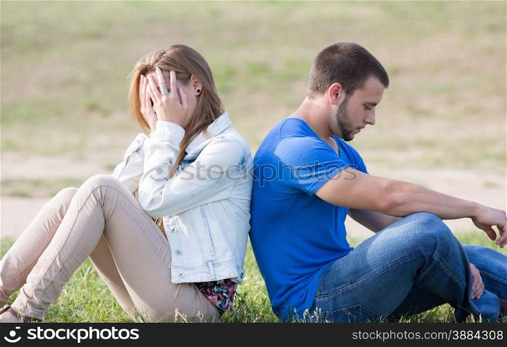 Couple sitting back with problems boyfriends