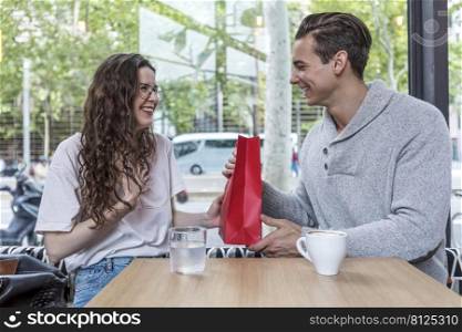 Couple sitting in a cafe on Valentine’s Day.