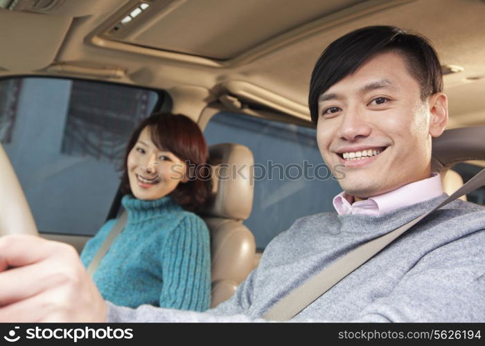 Couple sitting in car, Beijing