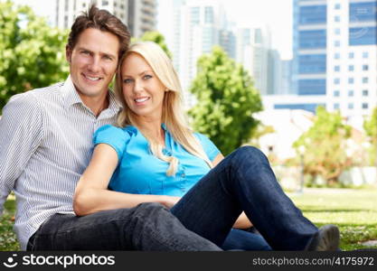 Couple sitting in city park