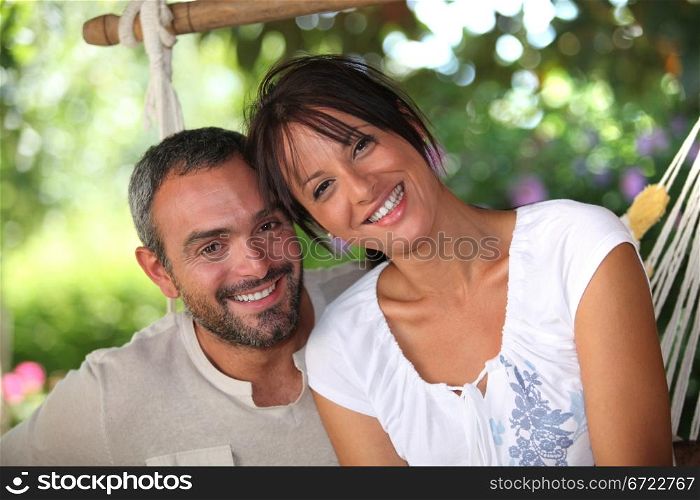 Couple sitting in hammock