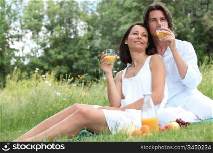couple sitting in high grass