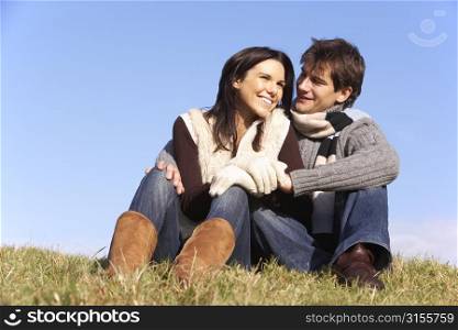 Couple Sitting In Park Together