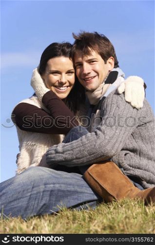 Couple Sitting In Park Together