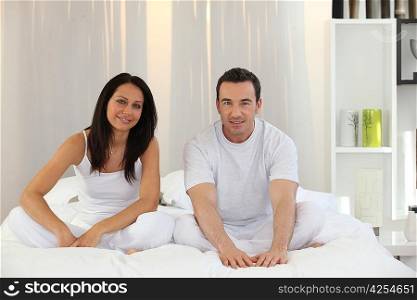 couple sitting in their bed