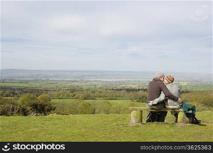 Couple Sitting on a Park Bench