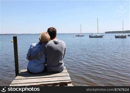 Couple sitting on a pontoon