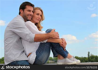 Couple sitting on curb