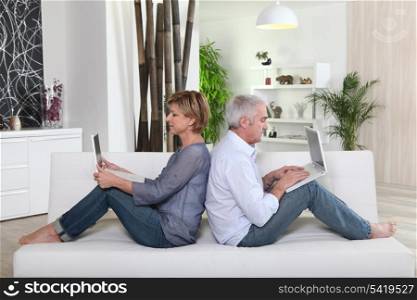 Couple sitting on sofa