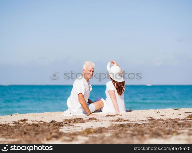 Couple sitting on the beach. Just us and the ocean