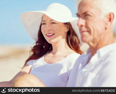 Couple sitting on the beach. Just us and the ocean