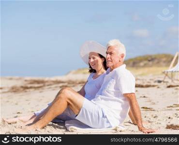 Couple sitting on the beach. Just us and the ocean