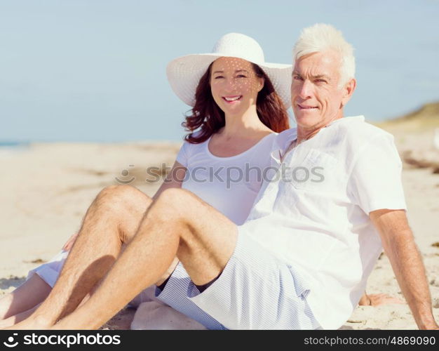 Couple sitting on the beach. Just us and the ocean