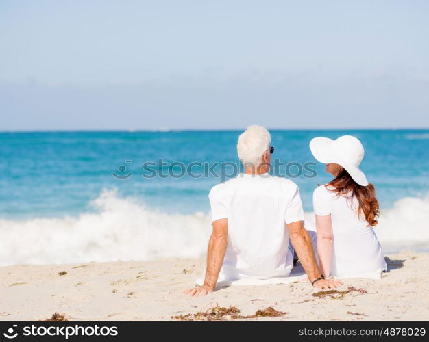 Couple sitting on the beach. Just us and the ocean