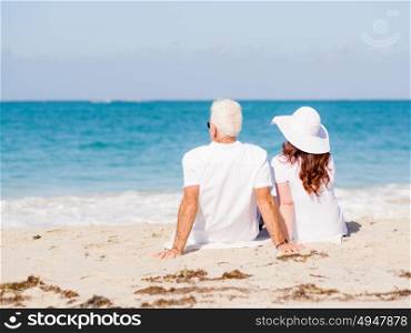 Couple sitting on the beach. Just us and the ocean
