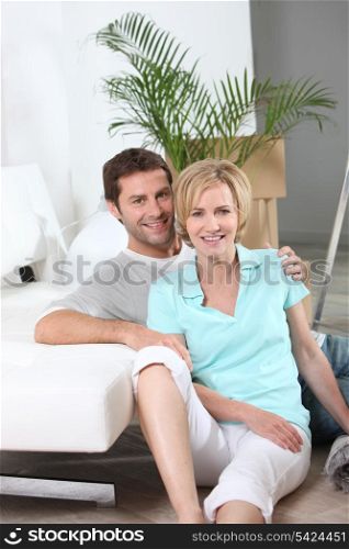 Couple sitting on the floor