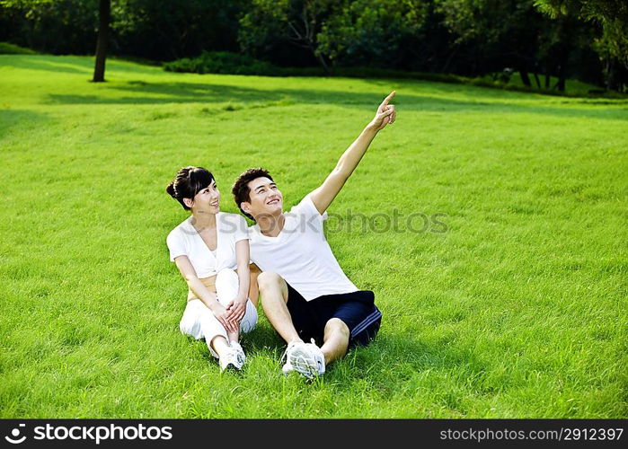 Couple sitting on the grass