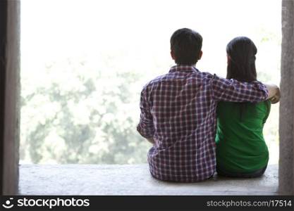 Couple sitting together in a fort