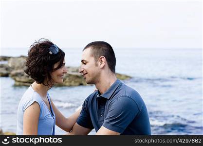 Couple sitting together on waterfront