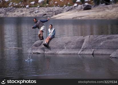 Couple Skipping Rocks Together